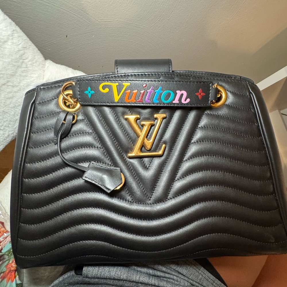 100% authentic Louis Vuitton Black Quilted Shoulder Bag with Gold Accents